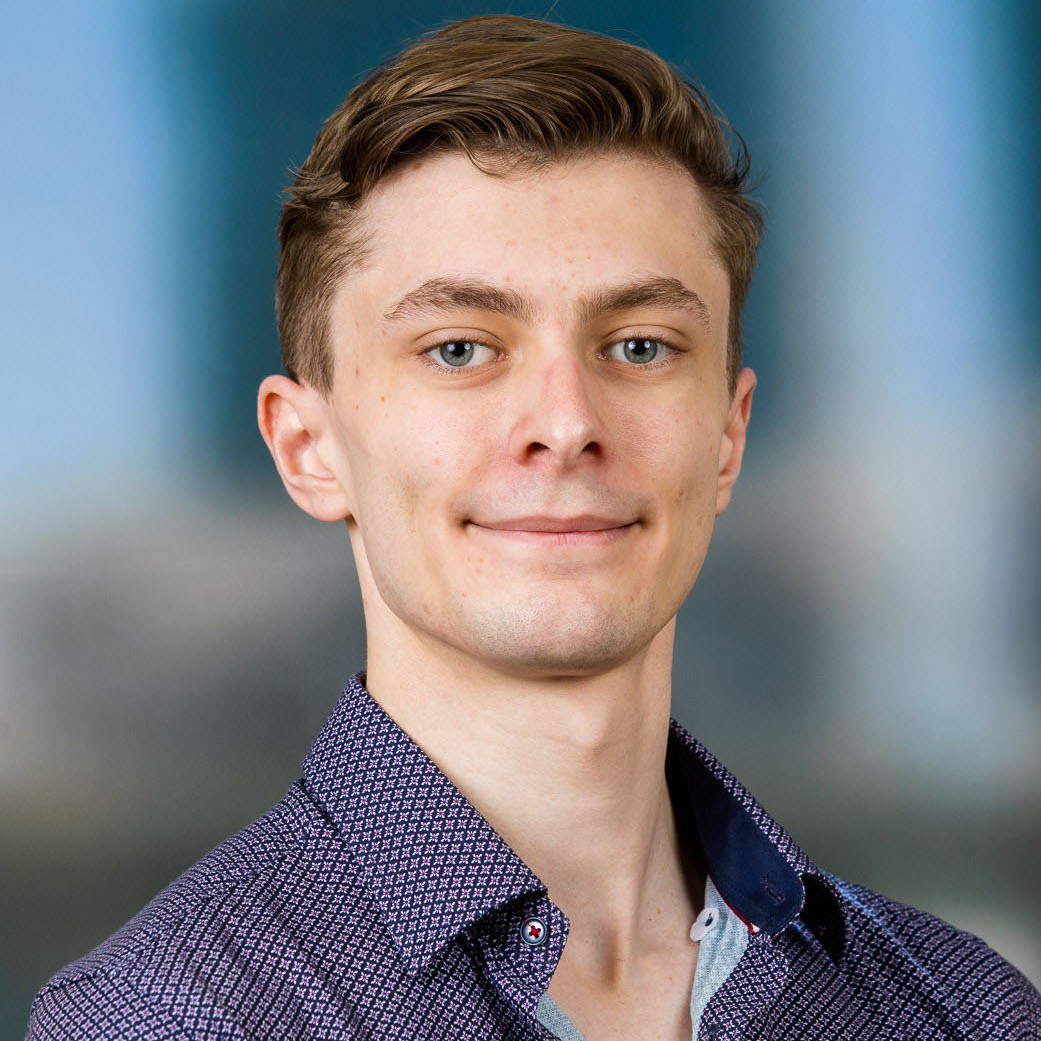 Professional headshot of Lachlan Grant